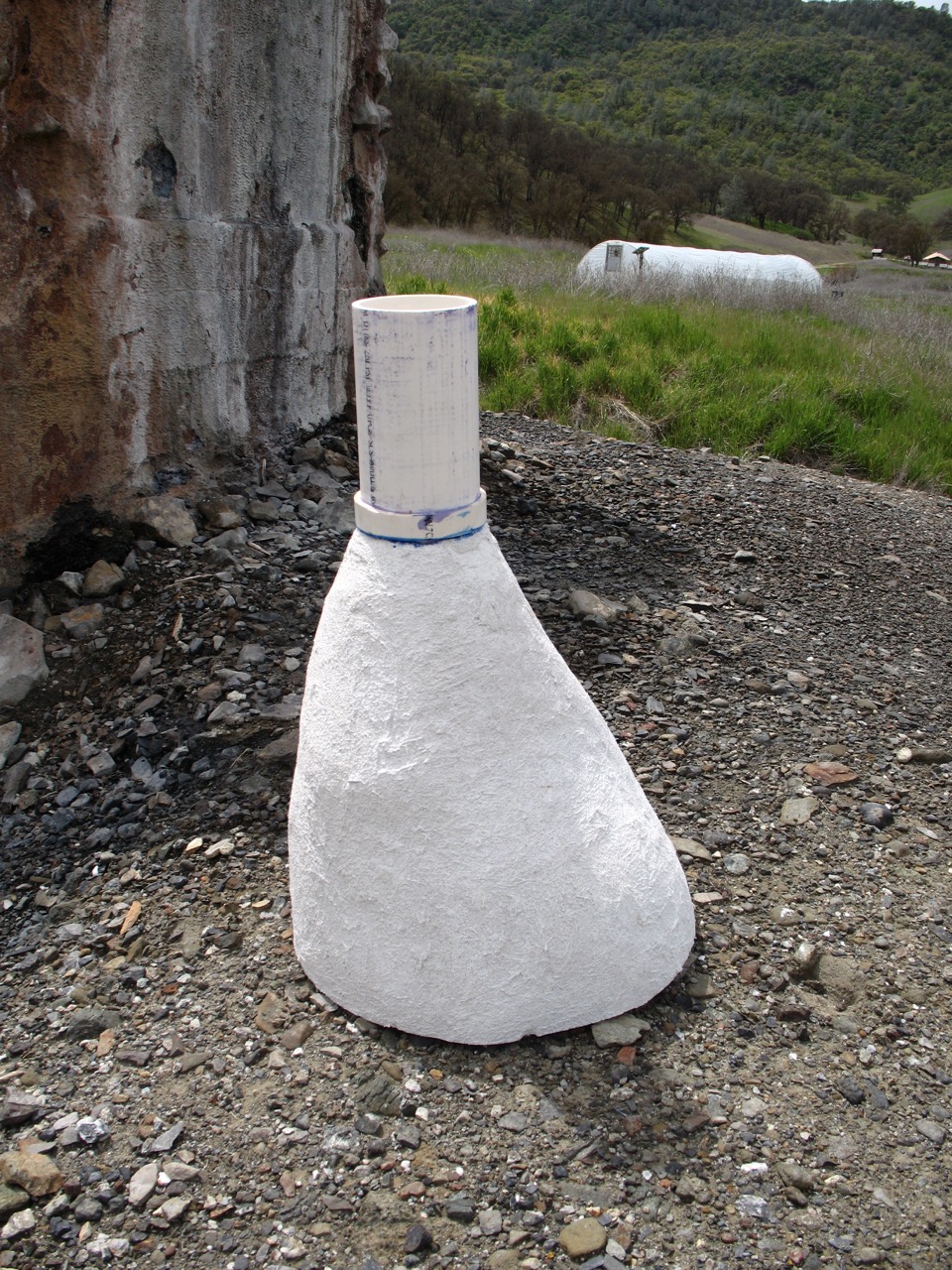 Finished cement form for capping the spring