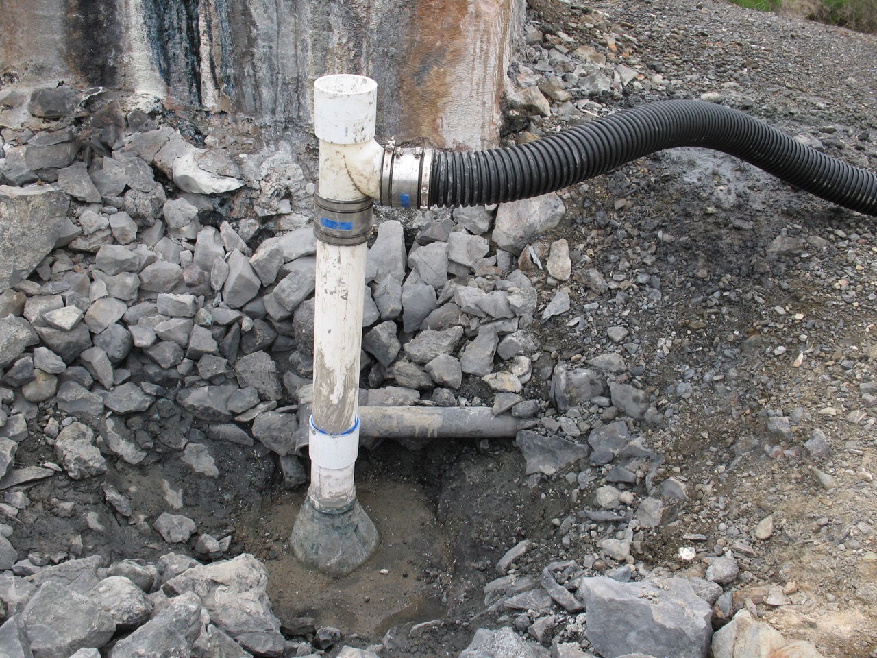 Capped spring with concrete plug