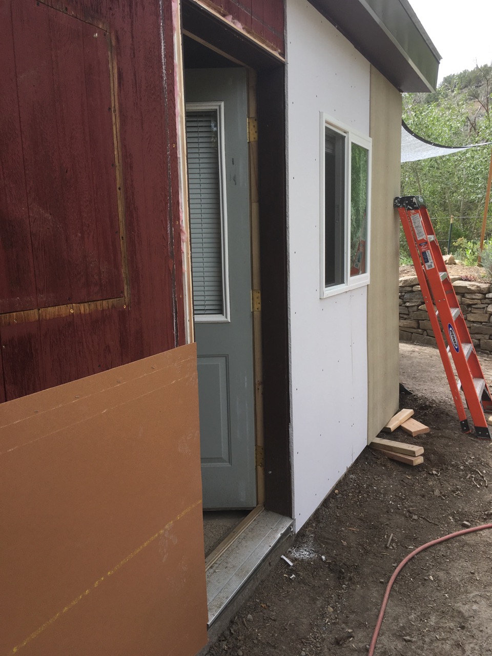 Water proofing, insulating, and siding walls